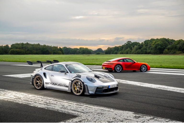 A silver Porsche 911 GT3 RS and a red Porsche 911 on an asphalt track, representing the high-performance modern vehicles that require C40-spec engine oil services at Cantech Automotive.